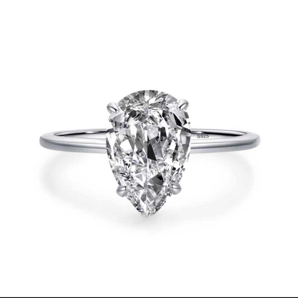 Luxury clear CZ ring , solid 925 Sterling Silver teardrop cut .